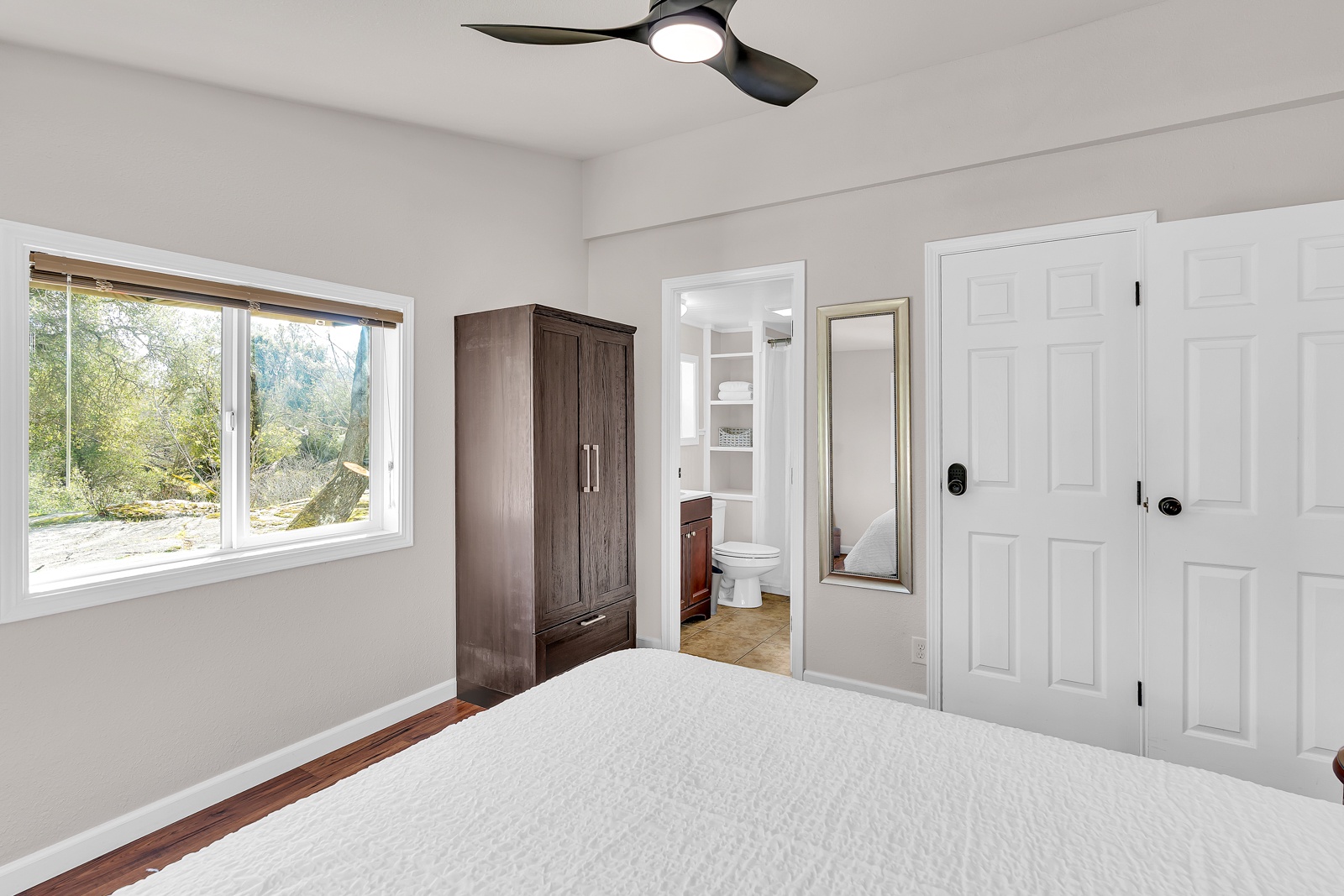 Relax in your bright bedroom with views of nature from your window.