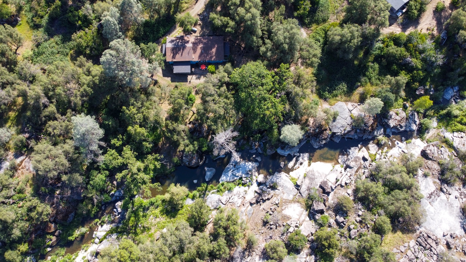 Aerial view of property offering privacy and tranquil surroundings.