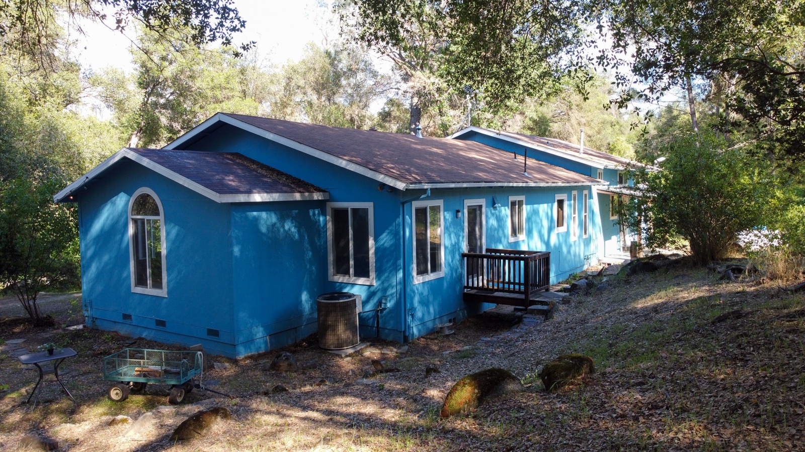 Charming and fun blue cottage offers a peaceful retreat.