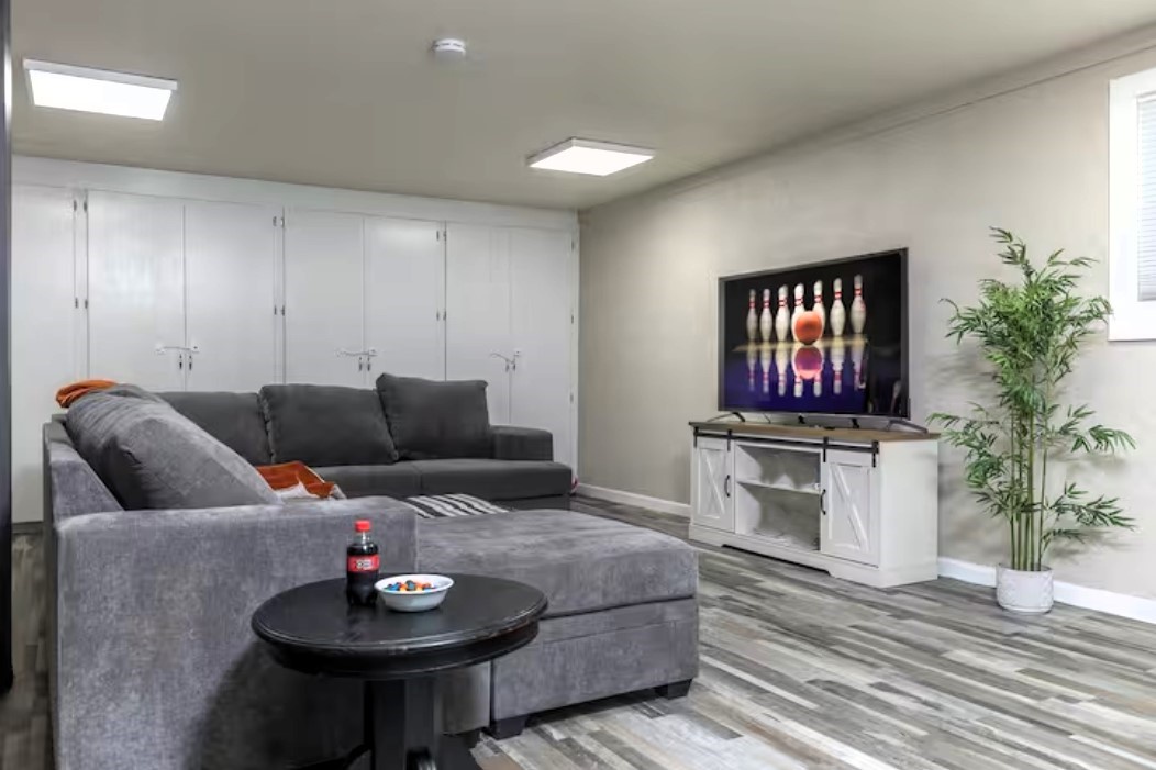 Unwind in your private entertainment space with plush seating and modern amenities for the perfect evening in.