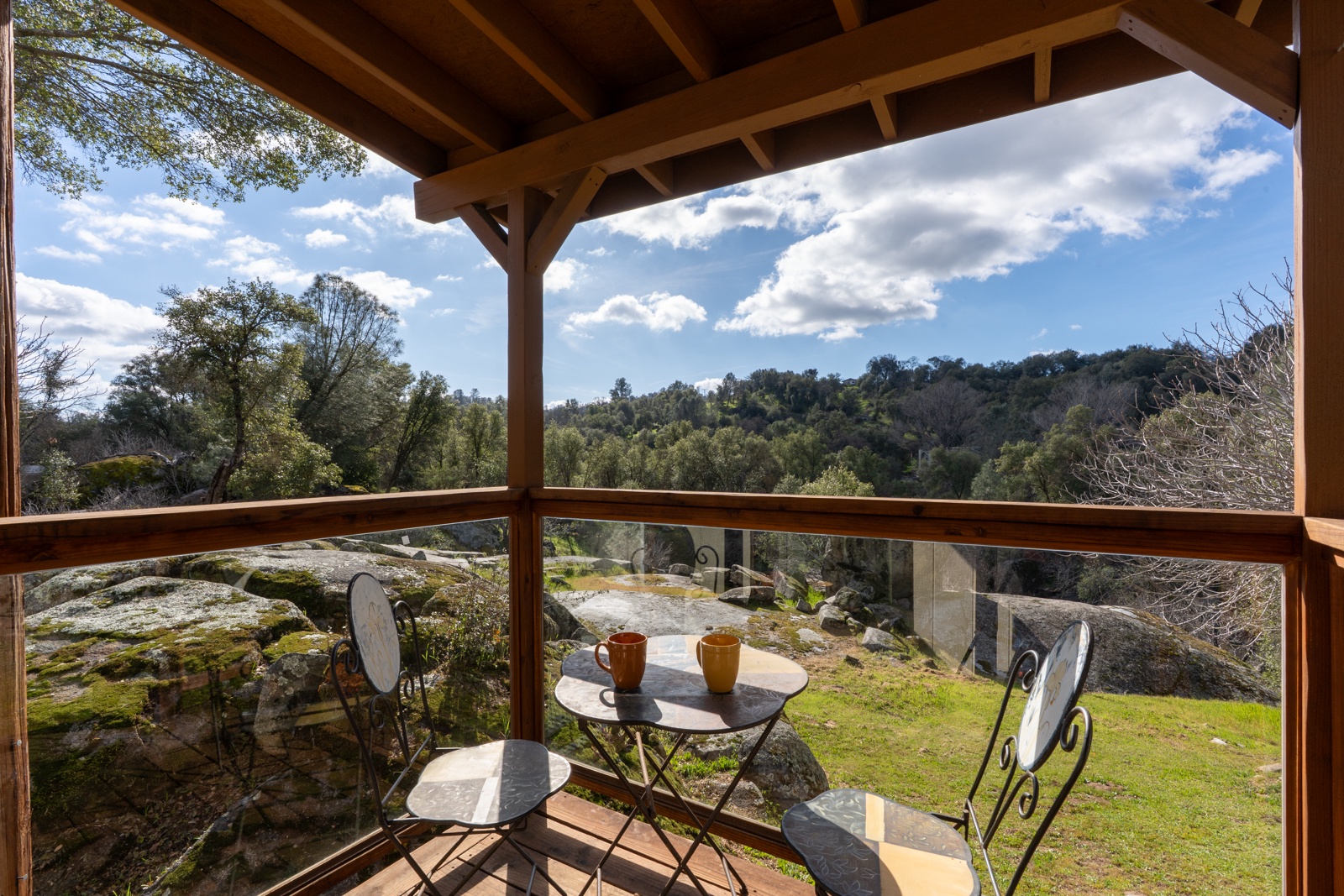 Sip your morning coffee on this small covered back patio with seating for 2.