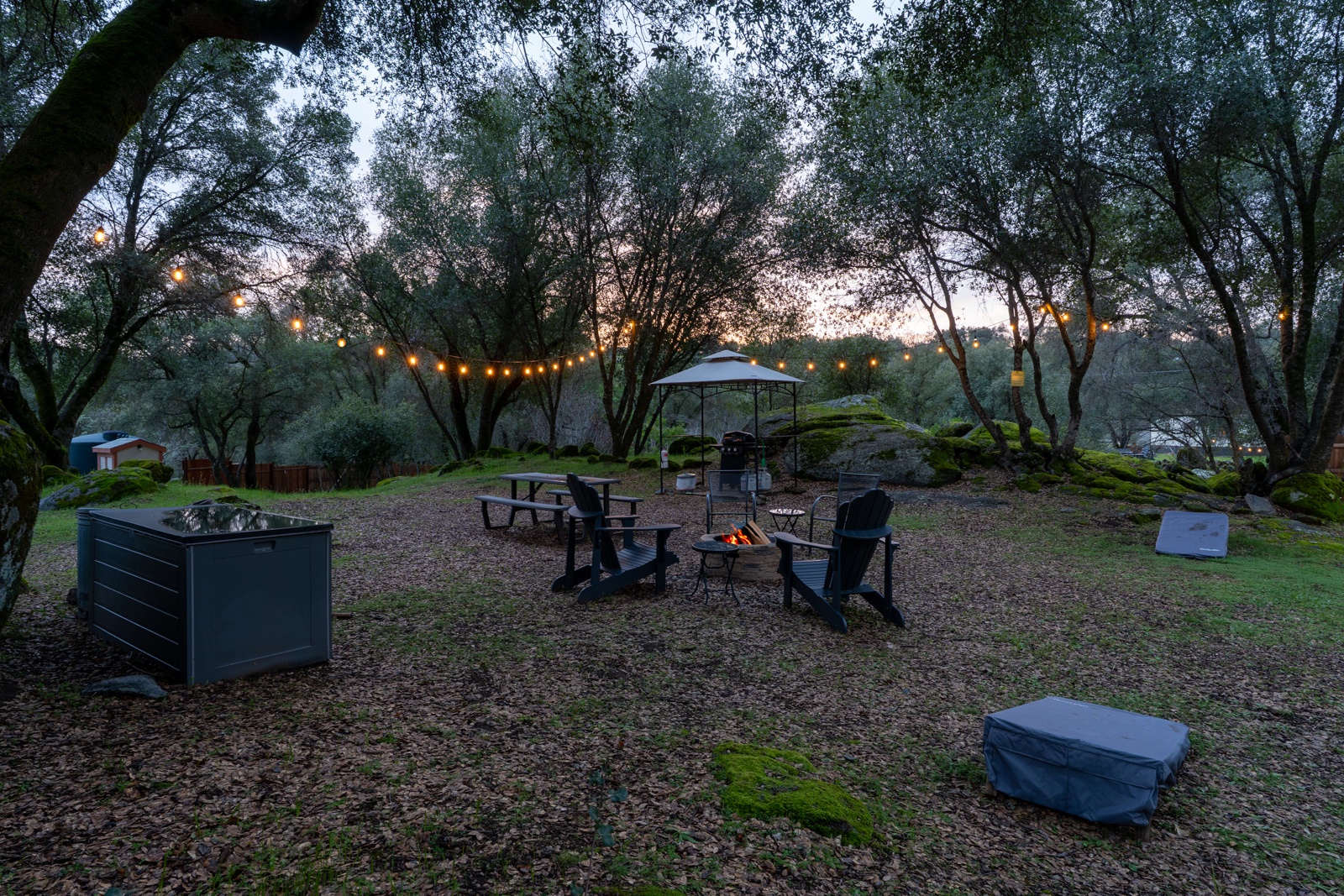 Gather around your private seasonal fire pit under twinkling lights, where evening conversations flow naturally.