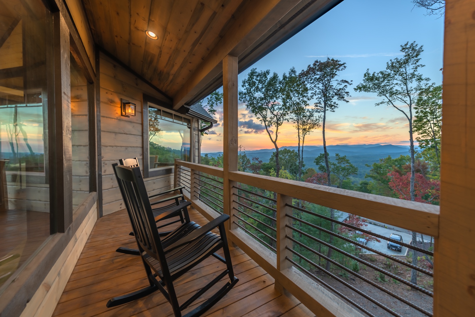 Highland Escape- Covered deck area with outdoor seating and mountain views