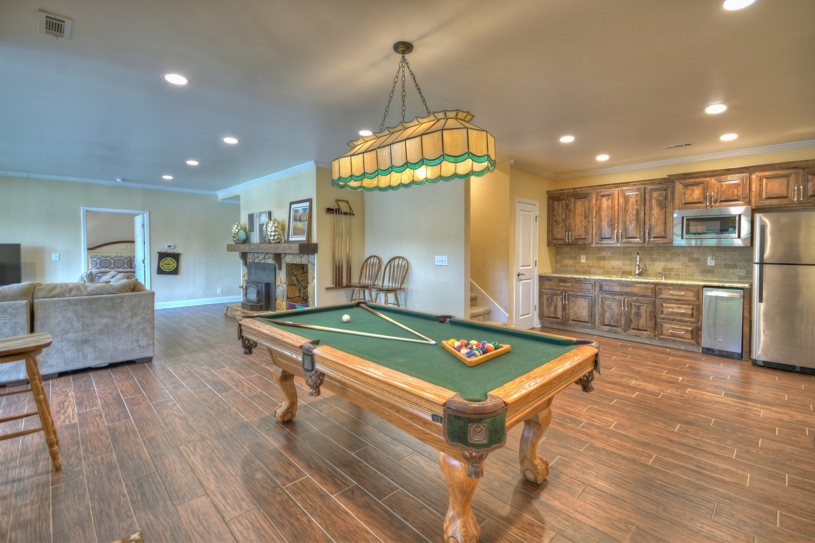 Jump Right In- Lower level living area with a pool table and kitchenette