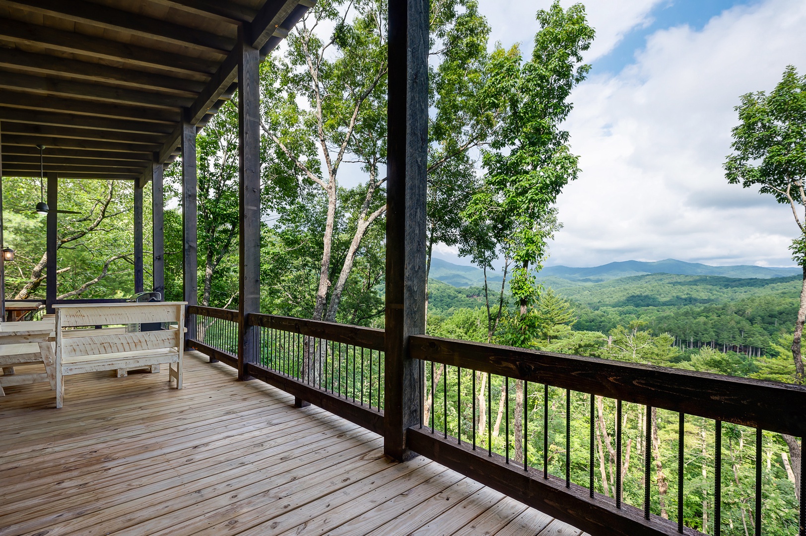 Feather & Fawn Lodge- Upper deck mountain views with outdoor seating