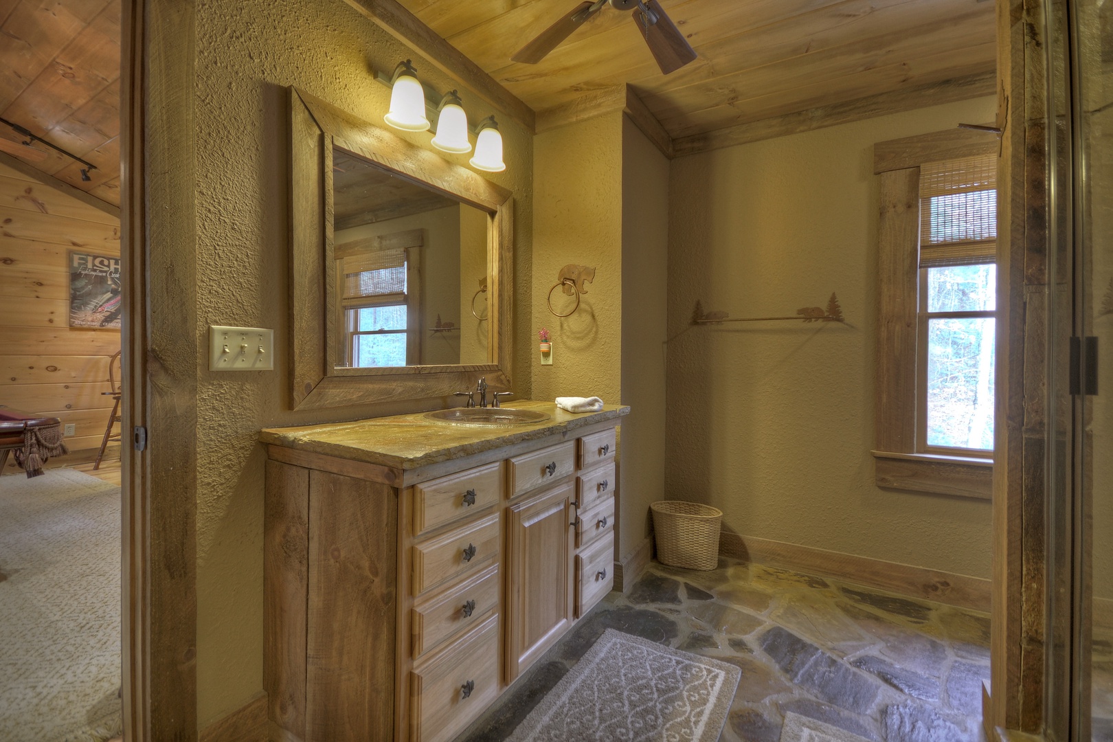 Reel Creek Lodge- Private bathroom view of the vanity sink and mirror