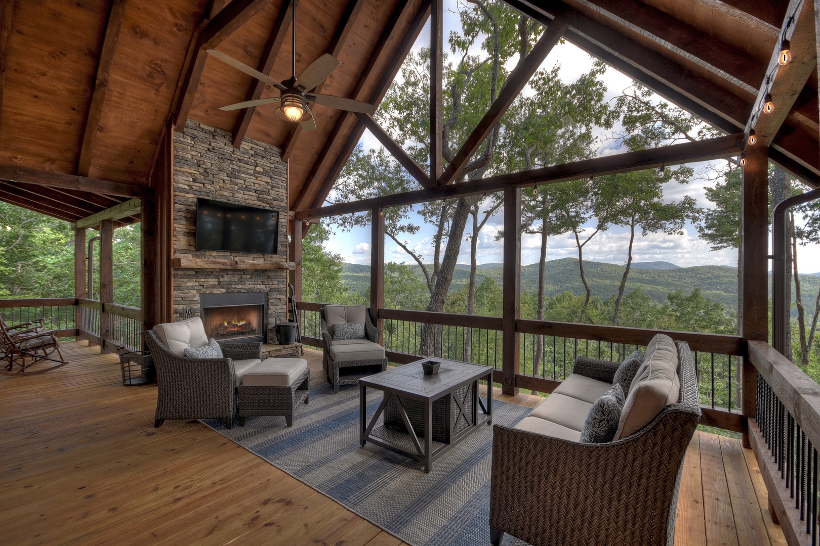 A Perfect Day- Entry level deck space with a fireplace and outdoor seating