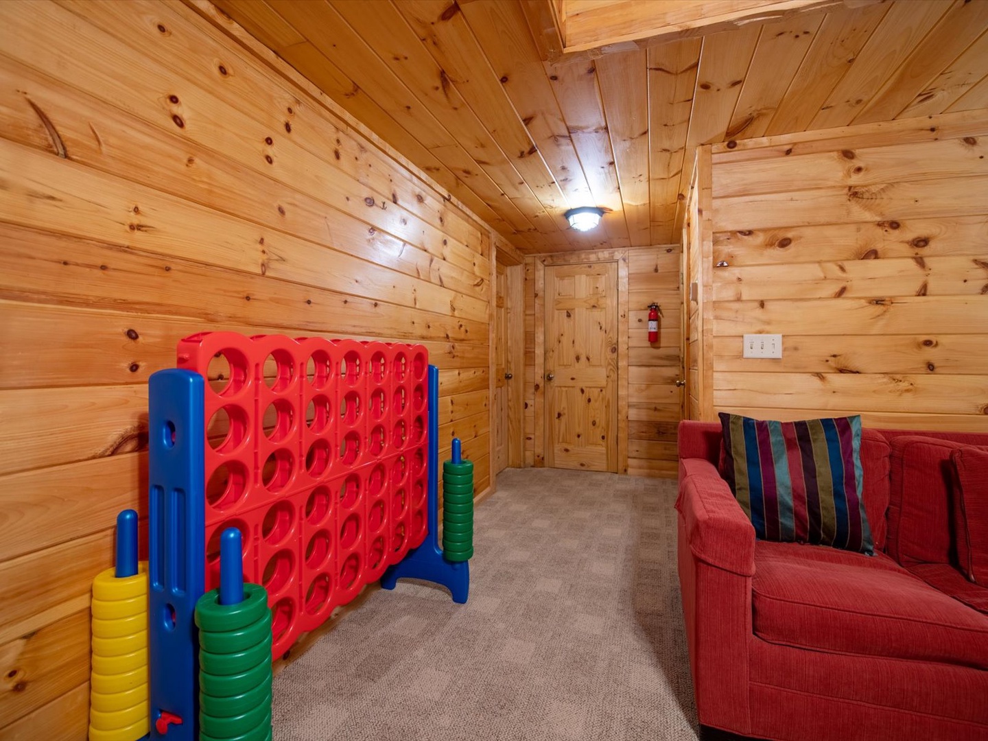 Aska Bliss- Large connect four game in a lounge game room