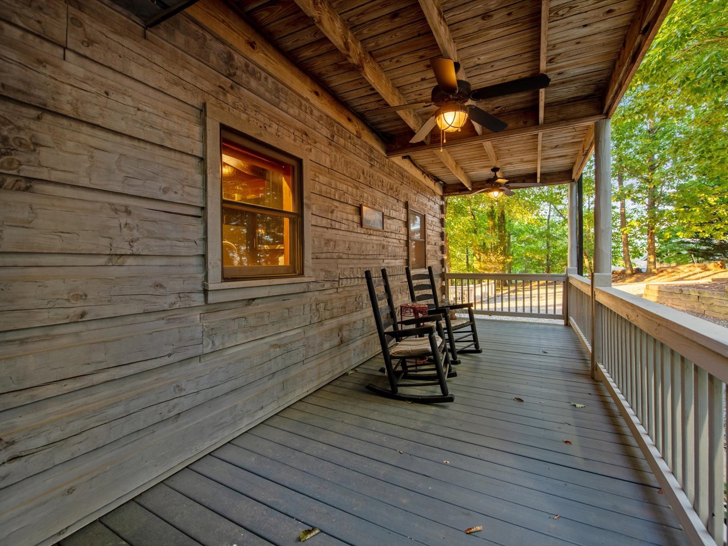 Aska Bliss- Front porch with seating and rustic cabin exterior