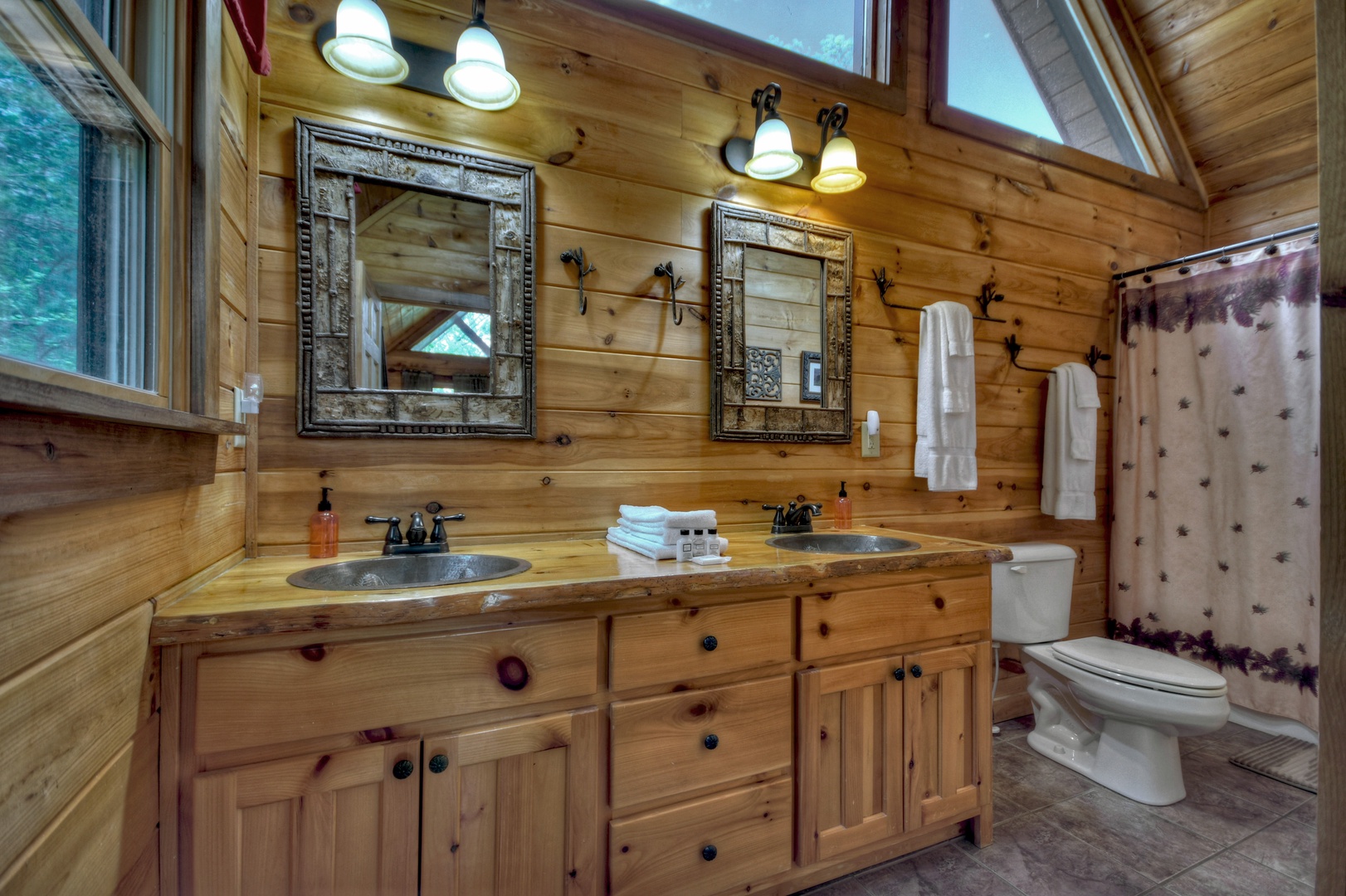 Aska Lodge- Double vanity sink and mirrors, with a toilet