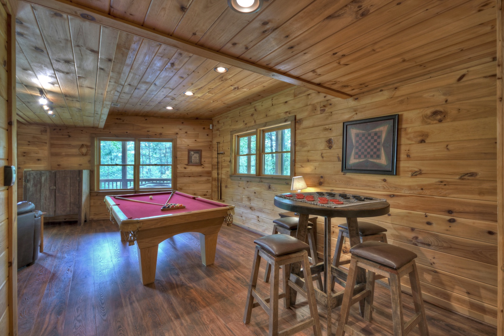 Aska Lodge- Lower level entertainment area with a pool table and card table and stools