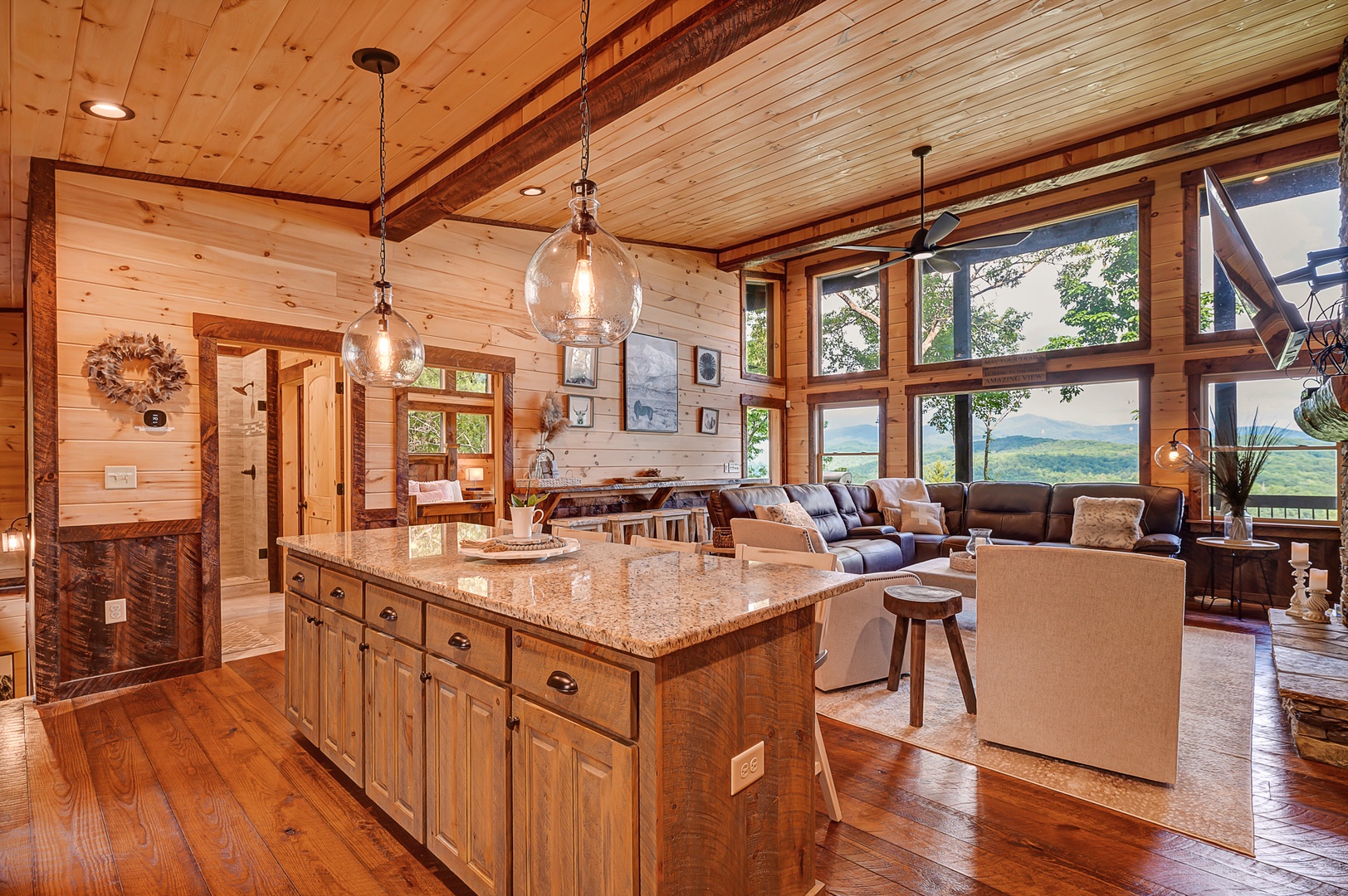 Feather & Fawn Lodge- Kitchen island overlooking the living room and views