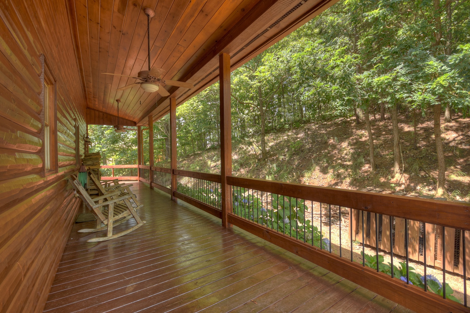Above Ravens Ridge- Entry level deck area with rocking chairs