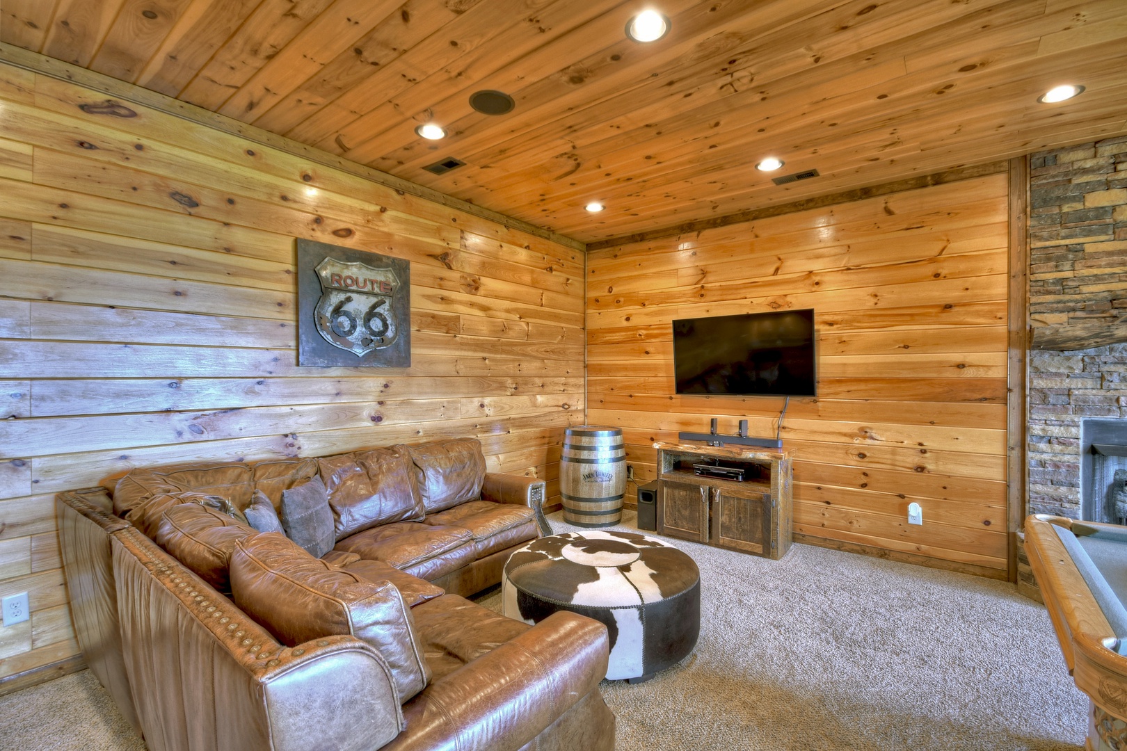 Grand Bluff Retreat- Lounge area with TV in the recreation room