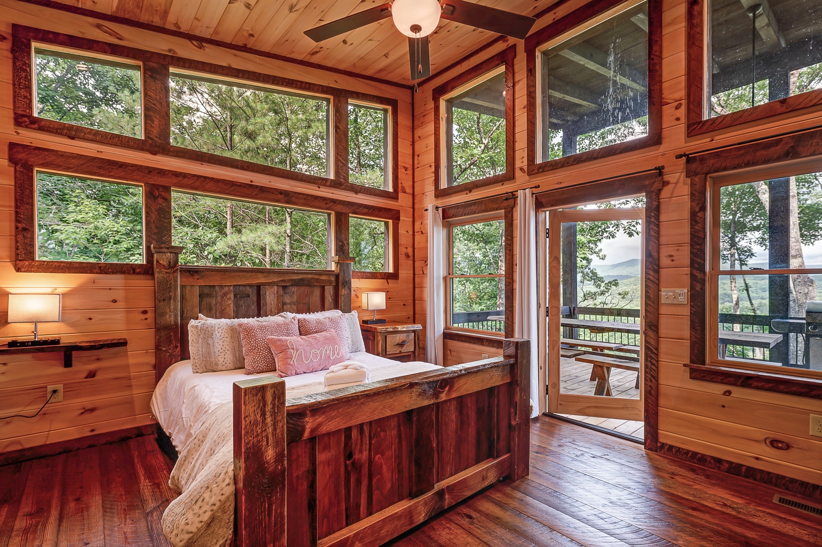 Feather & Fawn Lodge- Entry level guest bedroom with deck access