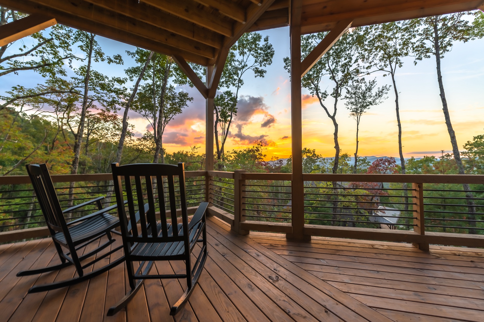 Highland Escape- Rocking chairs on the deck with mountain views