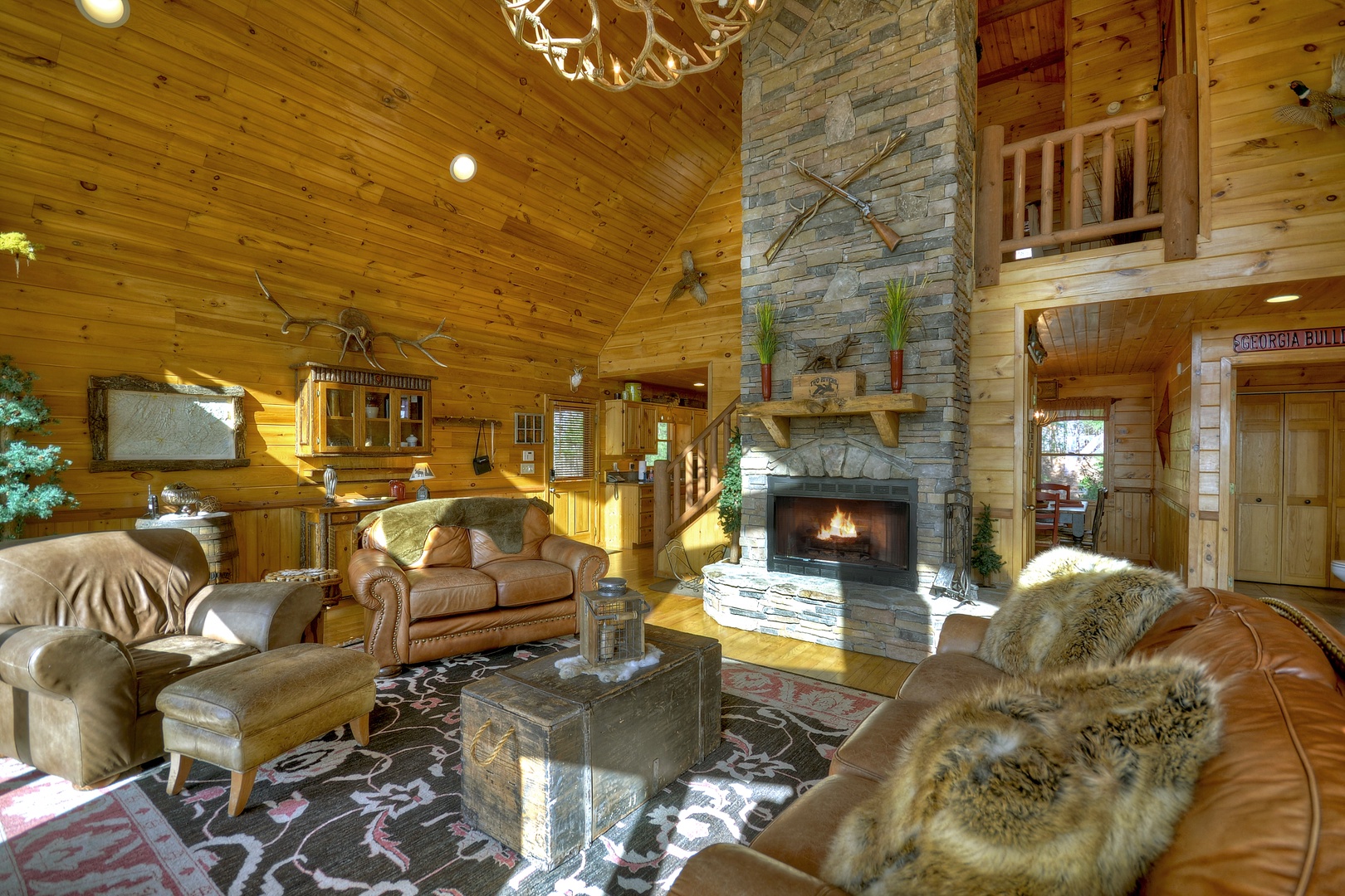 Grand Mountain Lodge- Living room with a fireplace and seating area