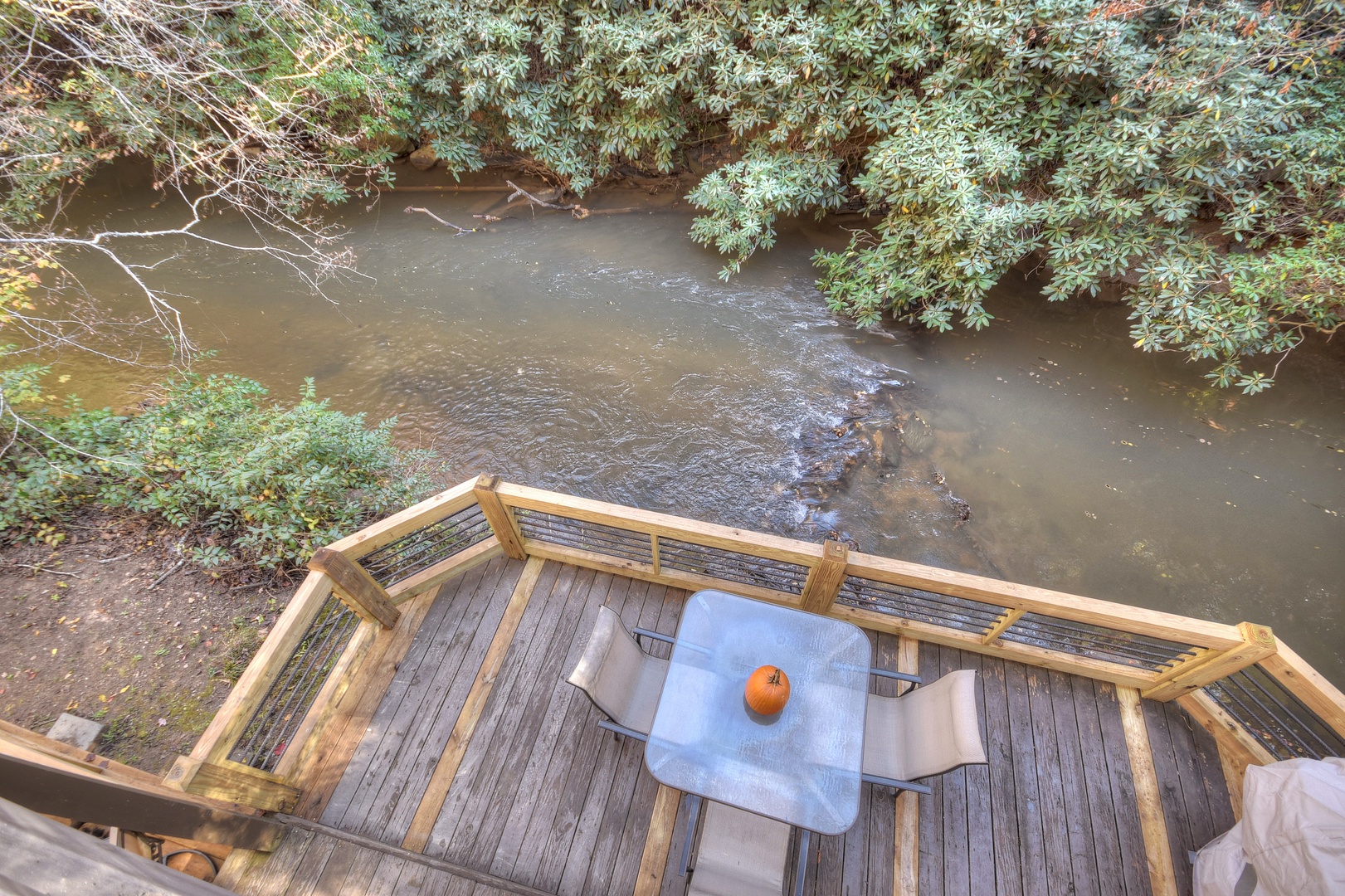 Happy Trout Hideaway- Upper level balcony view looking onto the entry level deck