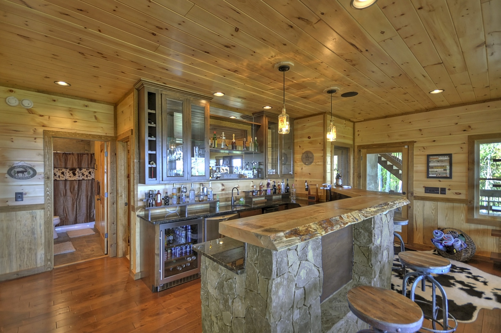The Vue Over Blue Ridge- Lower level bar area with an island and stool seating