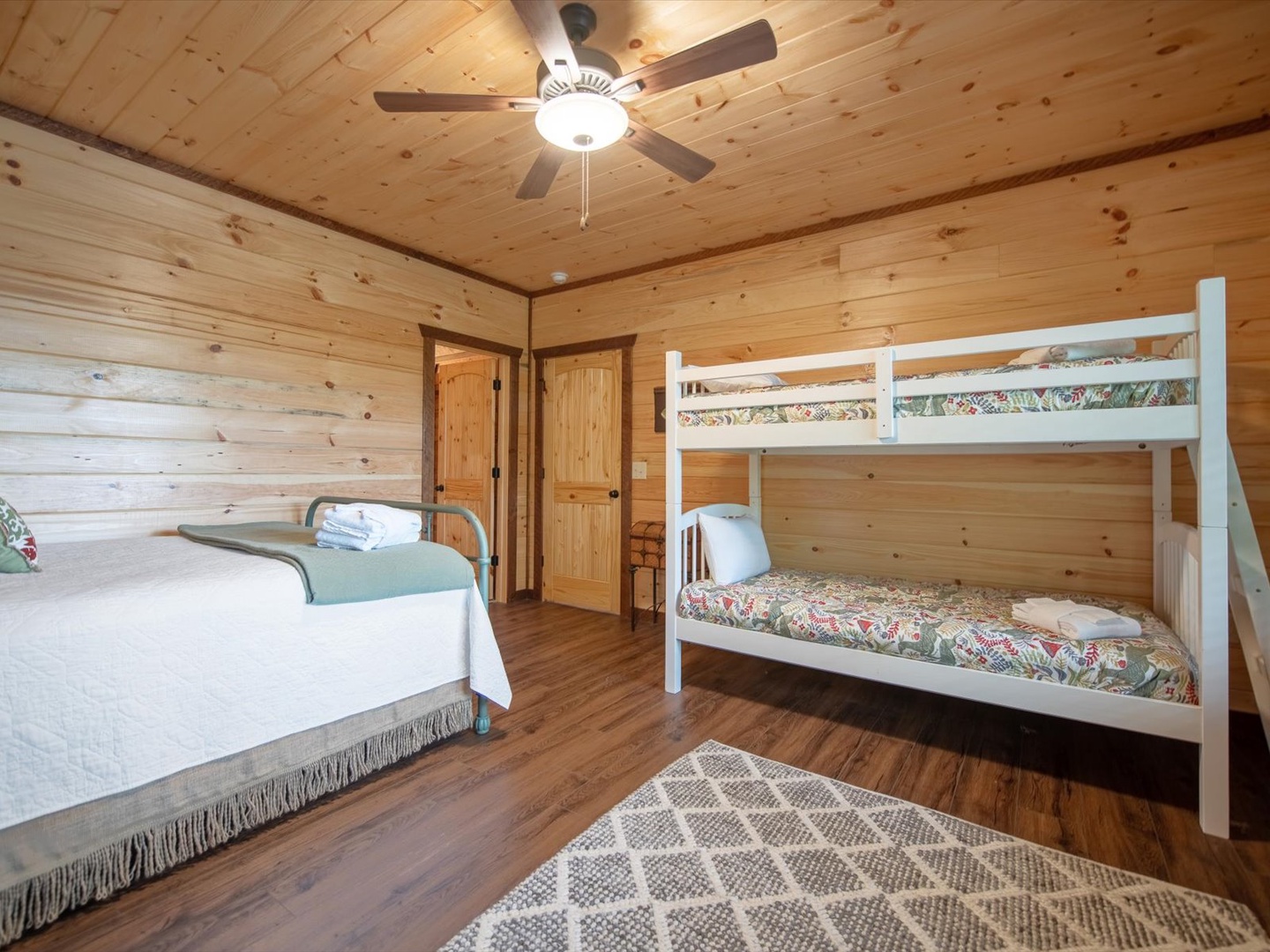 Aska Favor- Lower level guest bedroom with a twin bunk bed