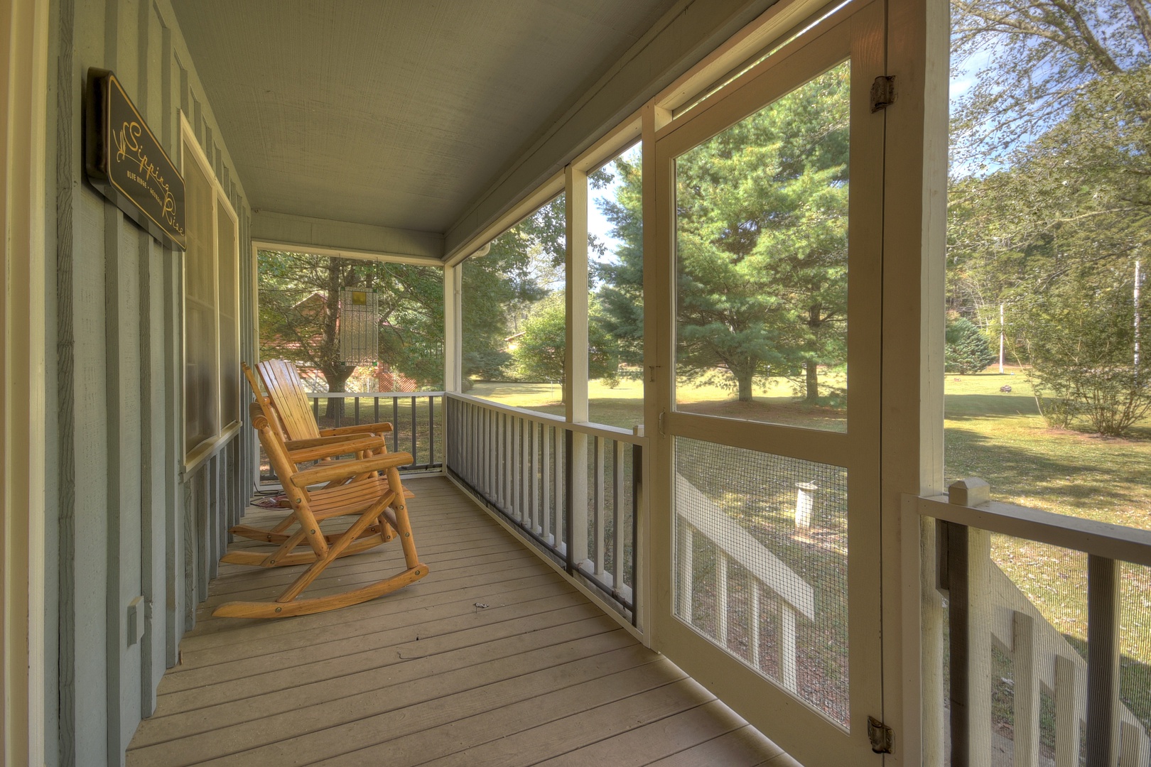 Sipping Rise- Front screened in porch area with rocking chairs