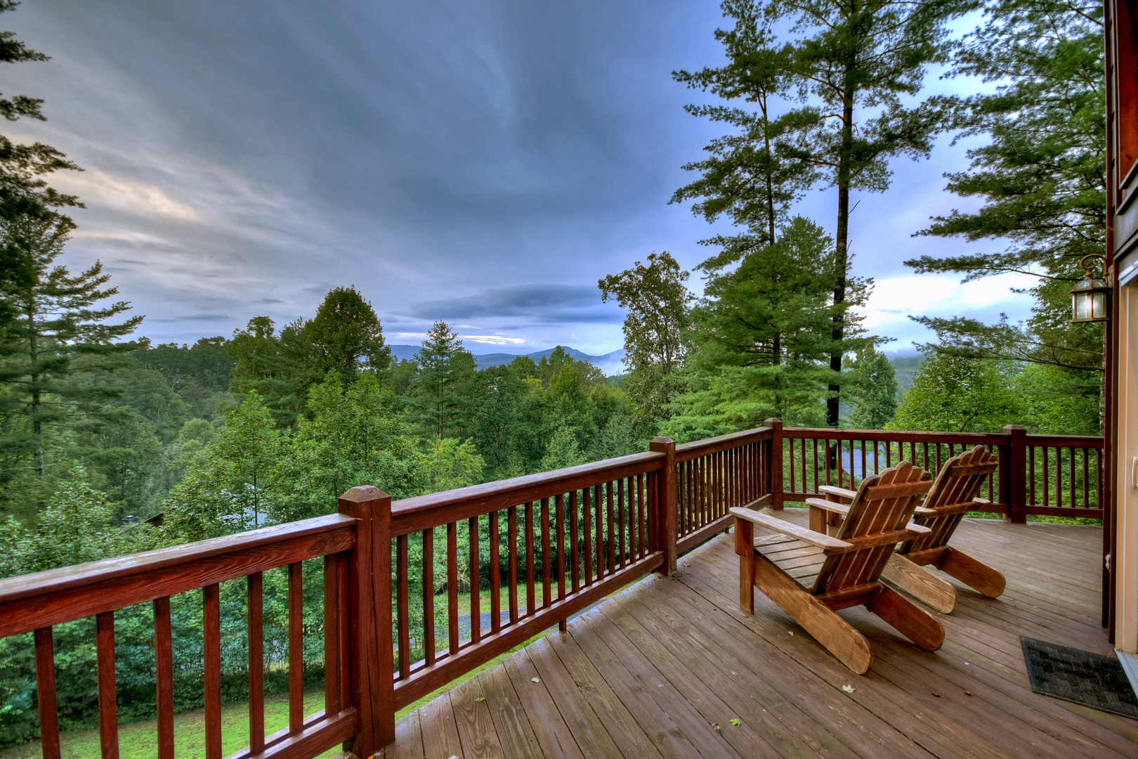 Mountain High Lodge - Entry Level Deck with Forest and Mountain Views at Dusk