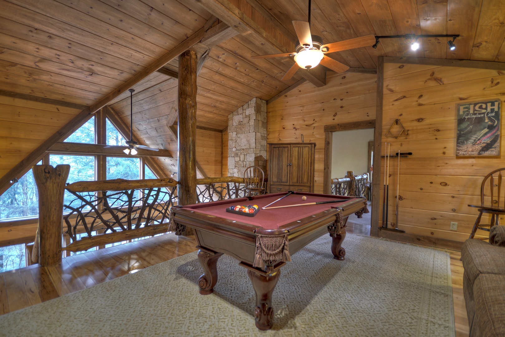 Reel Creek Lodge- Upper level pool table in the loft with forest views