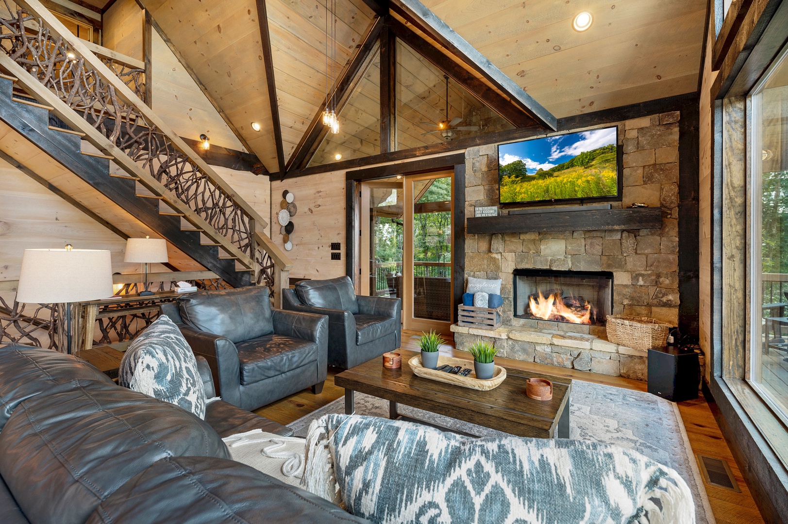 Mountain Echoes- Living room area with a fireplace and TV