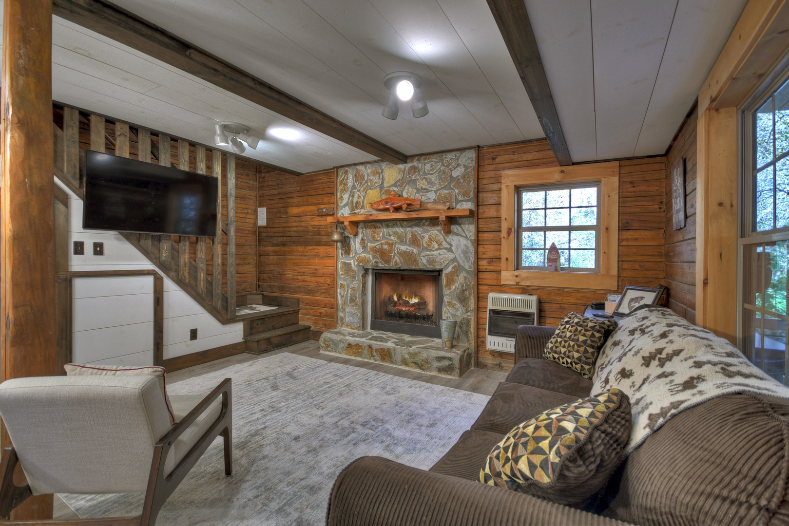 Happy Trout Hideaway- Entry level living room with fireplace