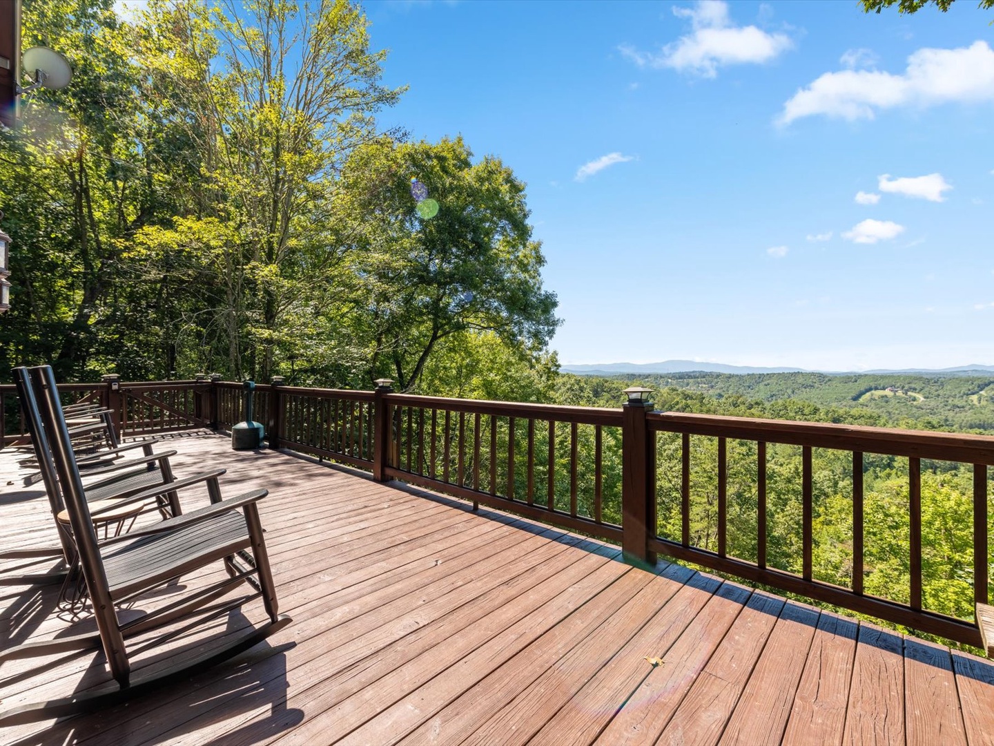 Bear Necessities: Entry level deck view of the cabin with outdoor seating