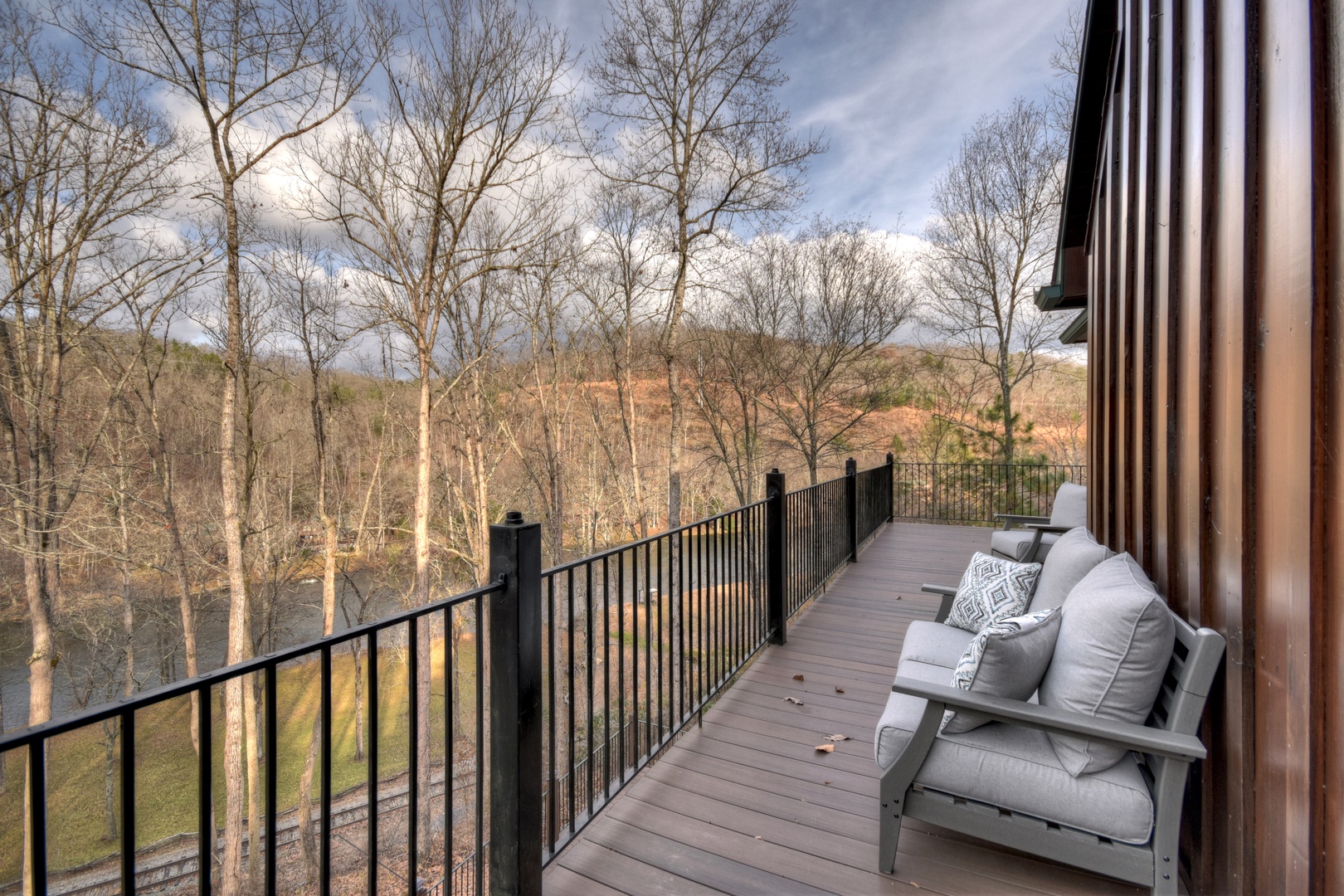 River Lodge- Upper deck area with outdoor seating overlooking the river