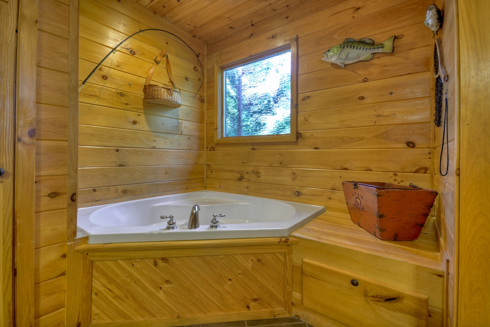 Grand Mountain Lodge- Entry level master bathroom with a soaker tub