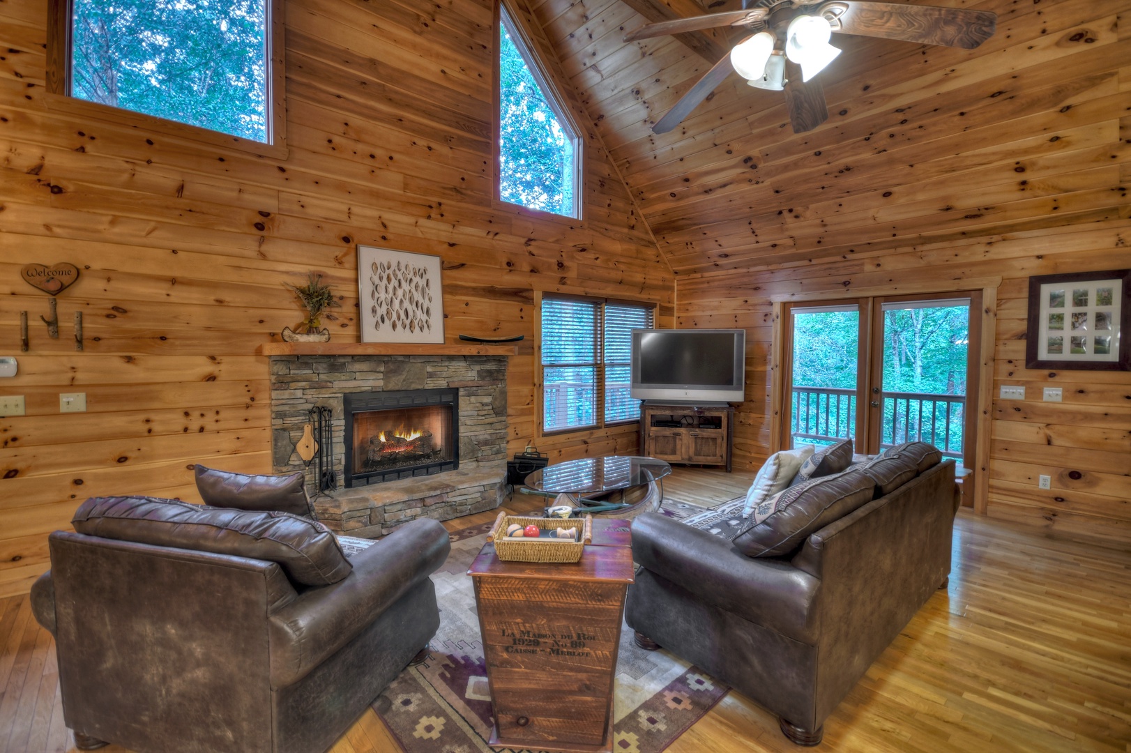 Hogback Haven- Entry level living area with a fireplace and TV