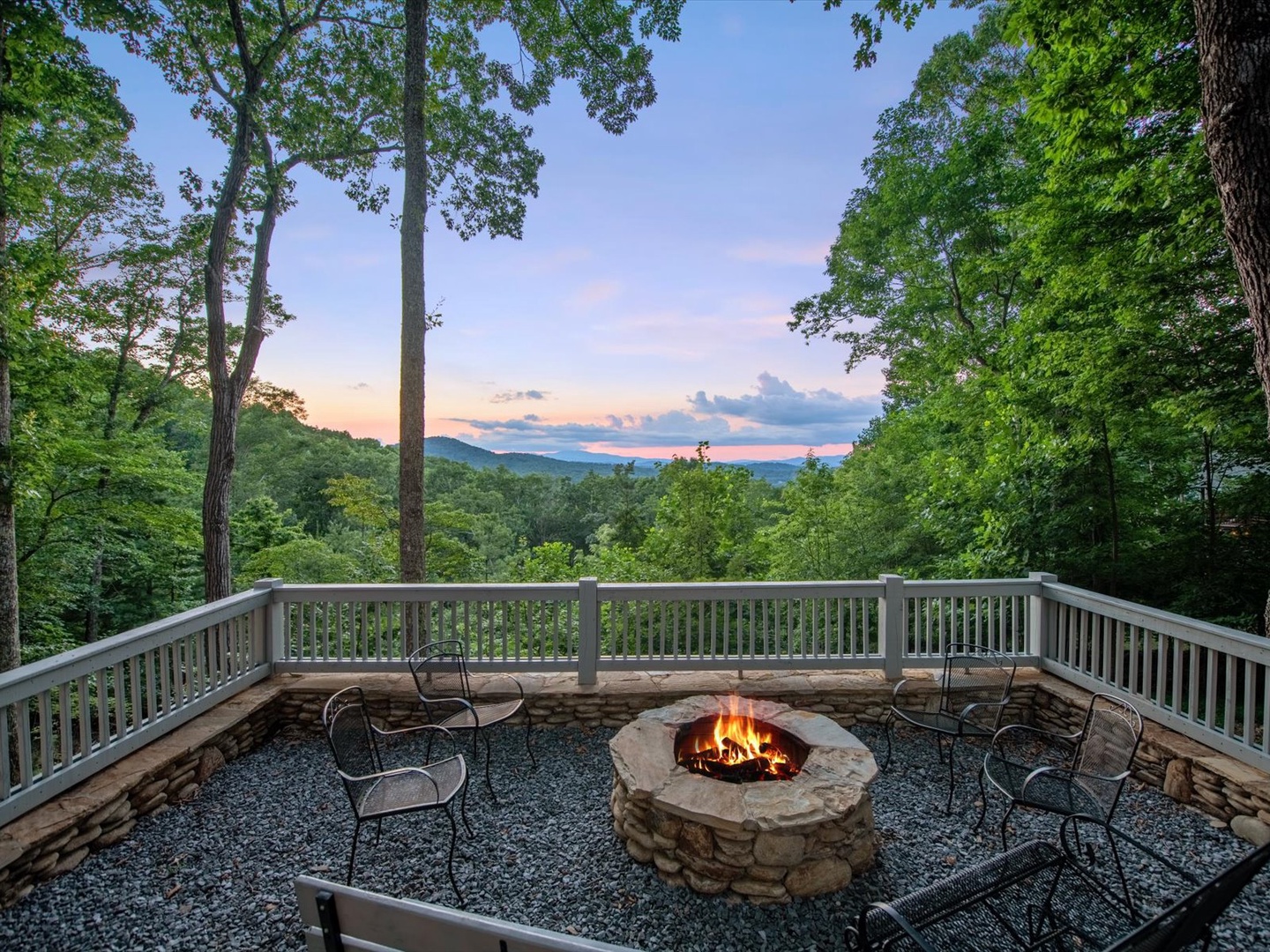 Aska Bliss- Outdoor fenced in stone firepit with a mountain view