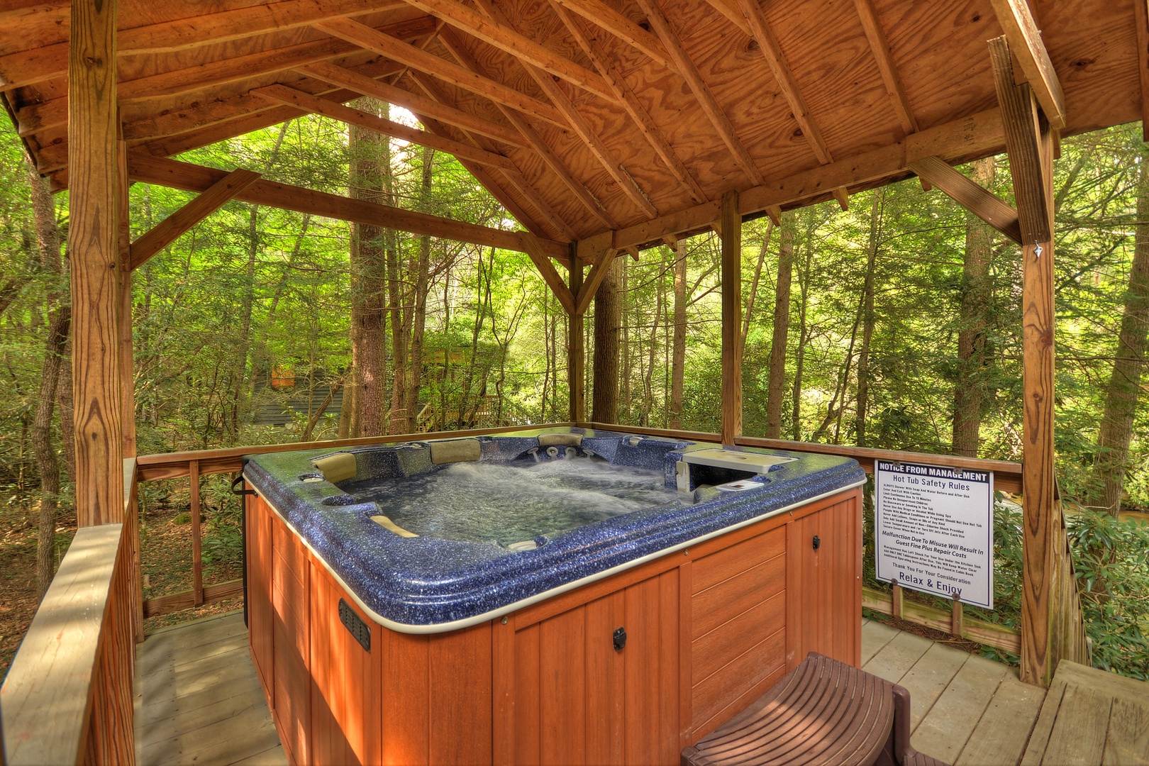 A Whitewater Retreat- Hot tub on the deck with forest views
