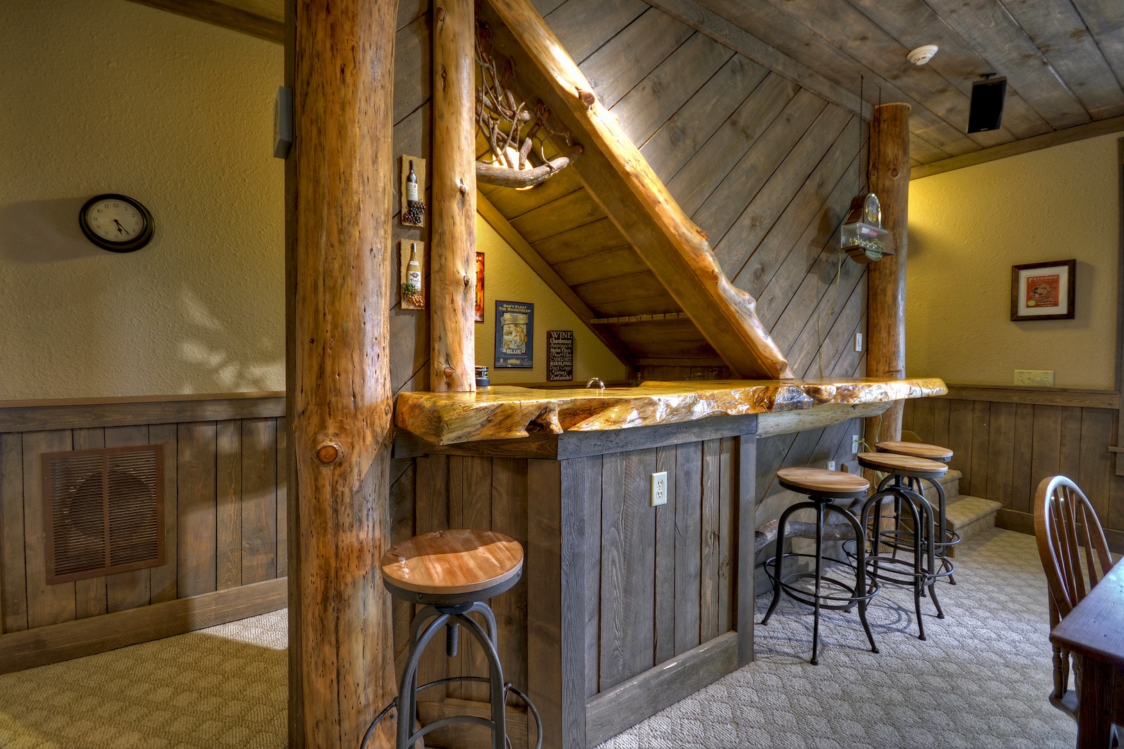 Reel Creek Lodge- Lower level wet bar with stools and an island