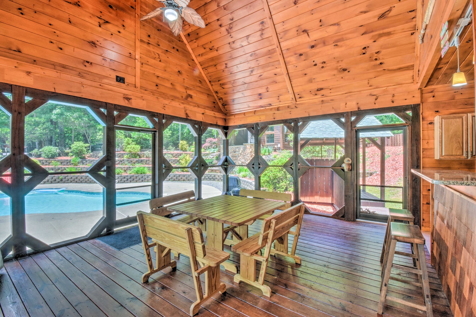 Deer Watch Lodge- Pool house with table and chairs