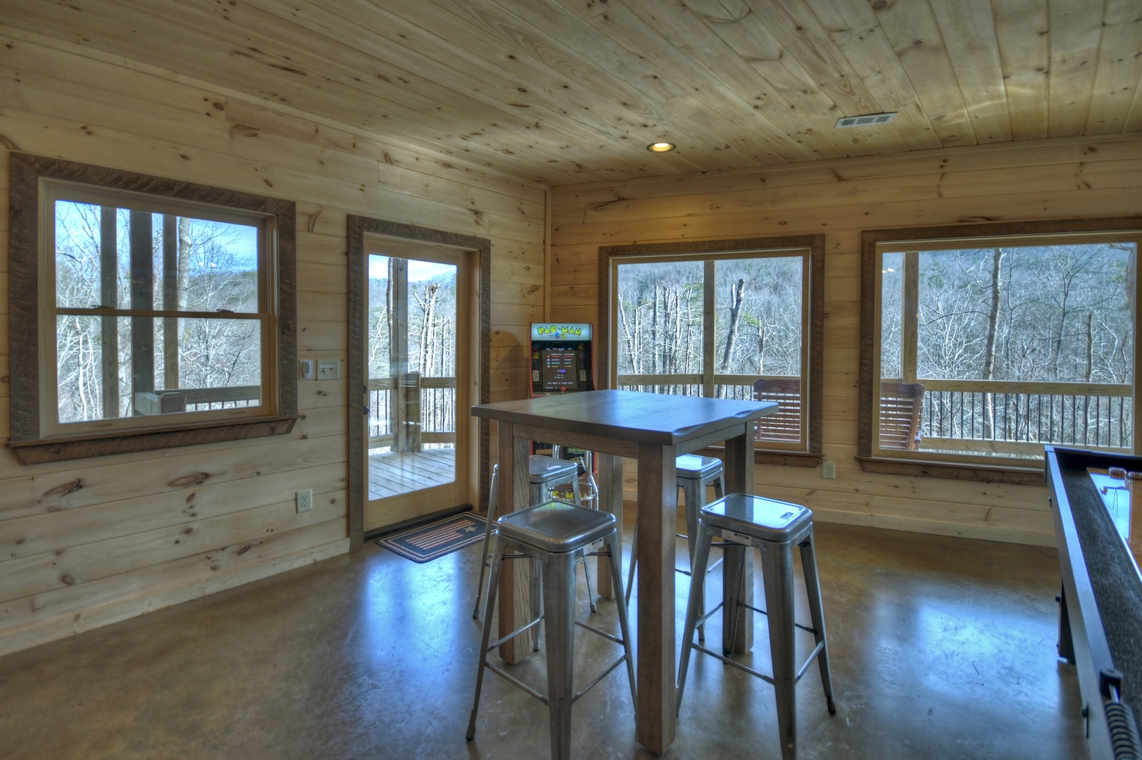 Whisky Creek Retreat- Lower level table seating and deck access