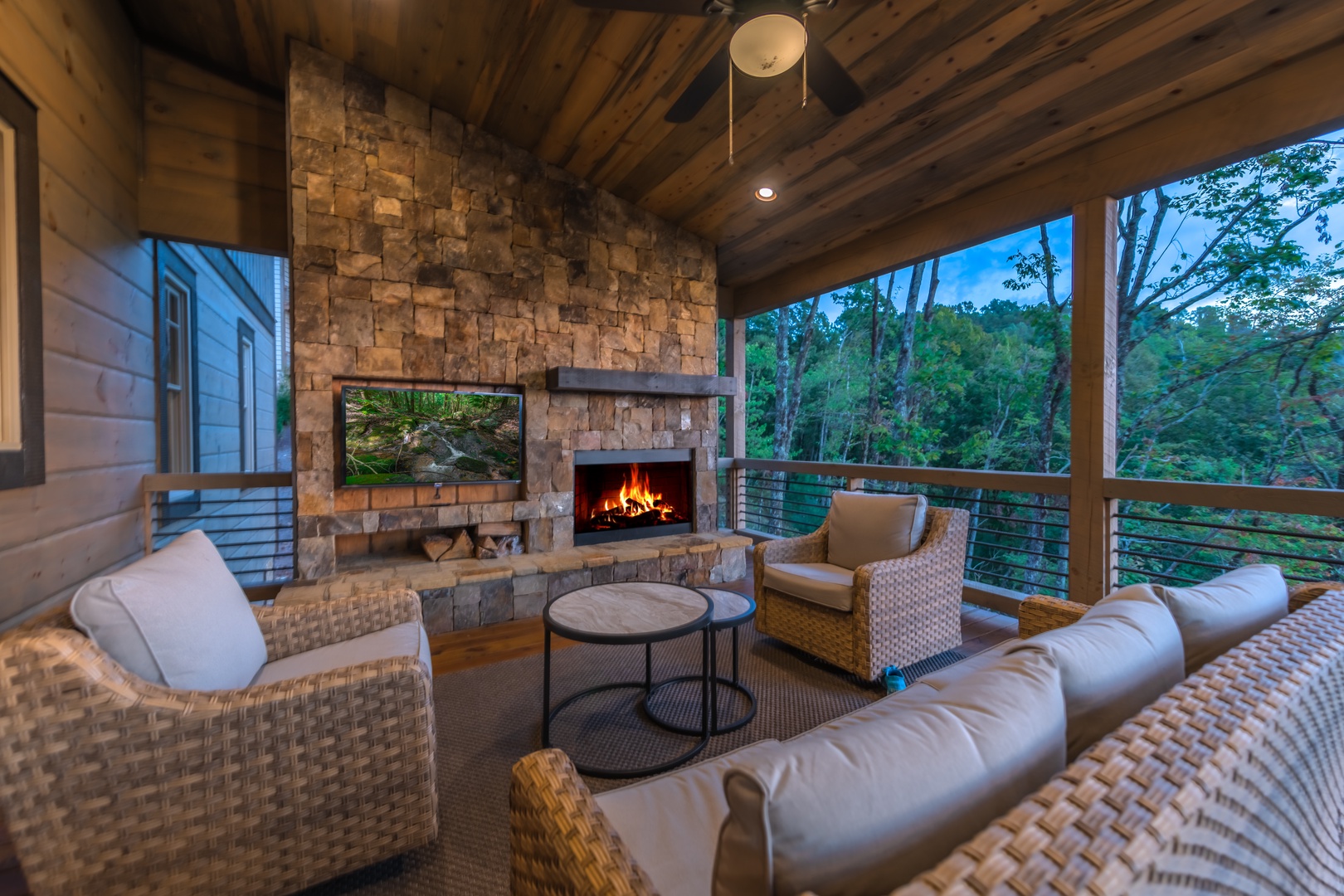 Highland Escape- Deck area with a fireplace and outdoor seating