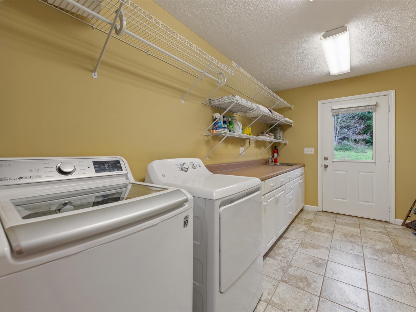 The River House - Entry Level Laundry Room