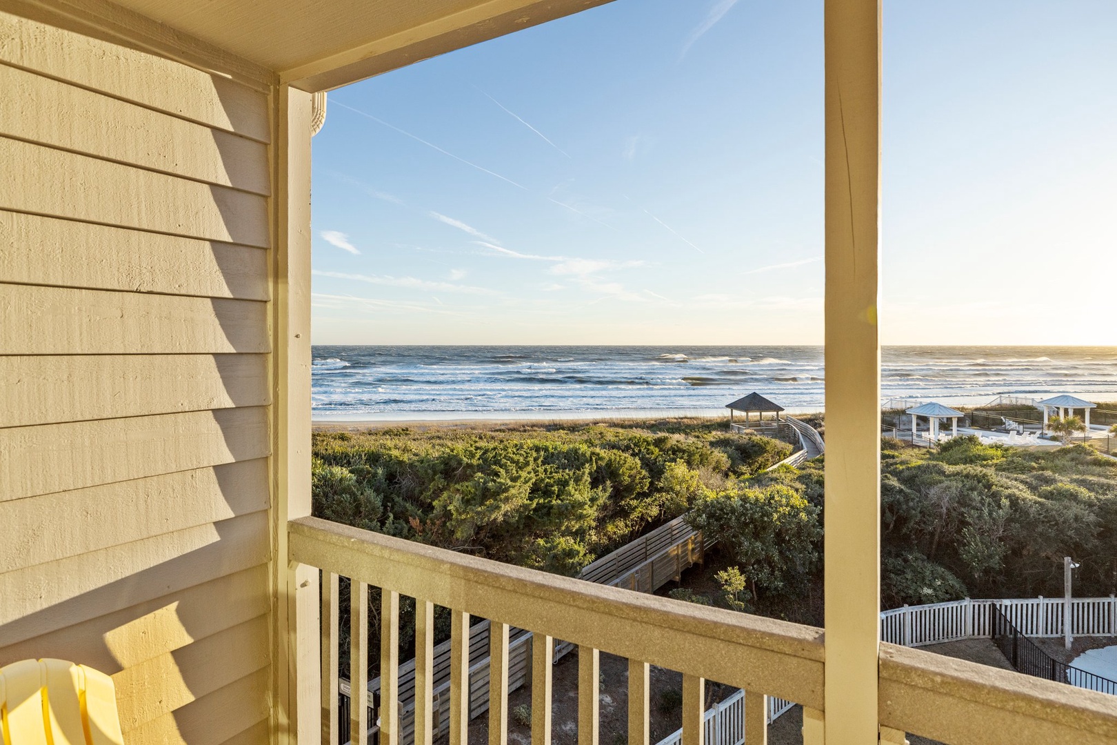 Balcony off primary bedroom with beach view