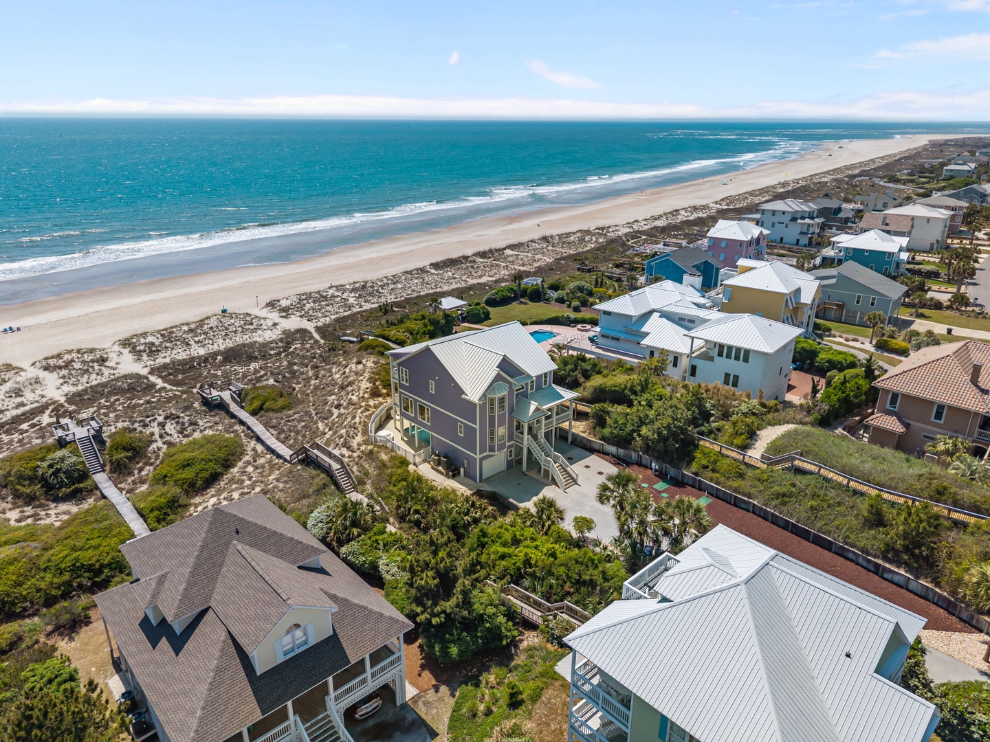 Stunning beachfront community with pristine sandy shores and turquoise waters stretching endlessly along the coast.