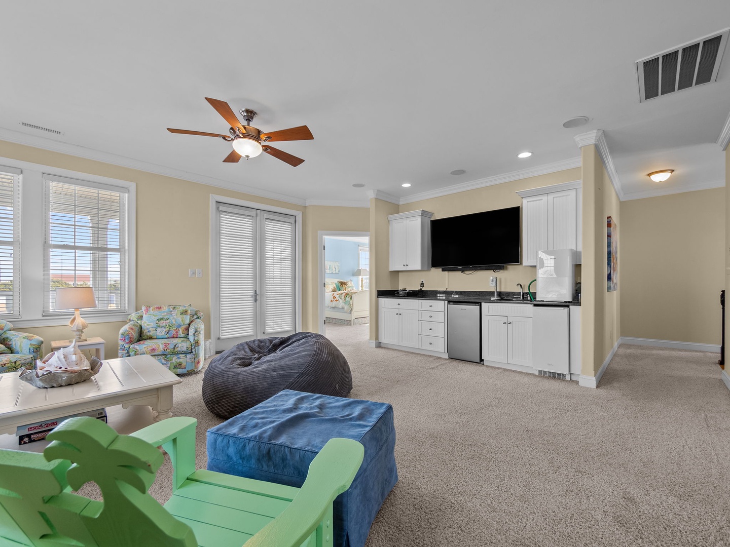 Relax in your spacious living area with cozy seating, kitchenette convenience, and coastal charm throughout.