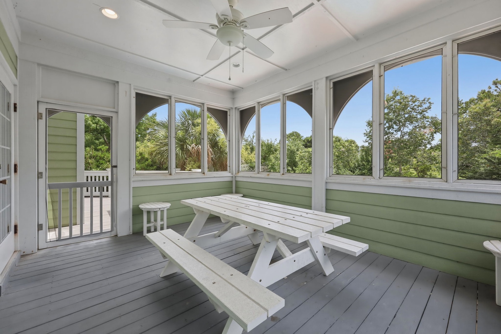 Your screened porch invites you to unwind with treetop views, a ceiling fan for gentle breezes, and a cozy picnic table perfect for morning coffee or sunset gatherings.