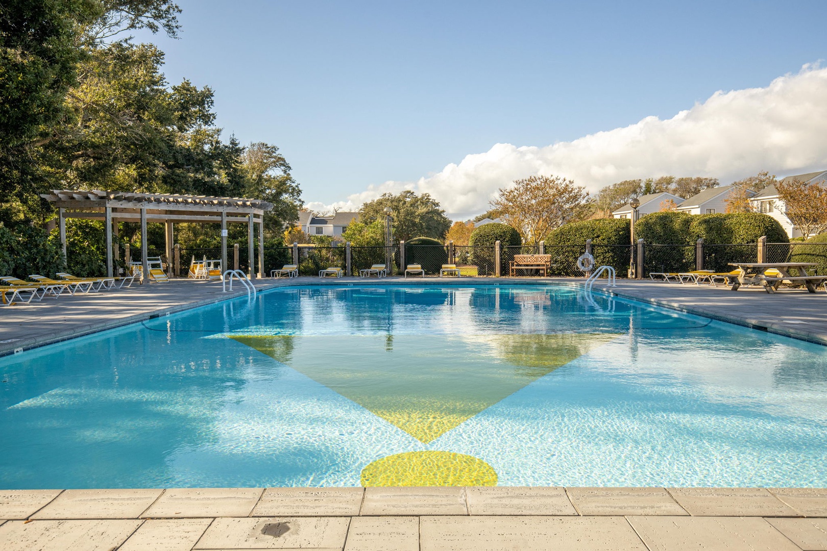 Sparkling pool surrounded by lush gardens and comfortable loungers awaits your perfect poolside retreat.
