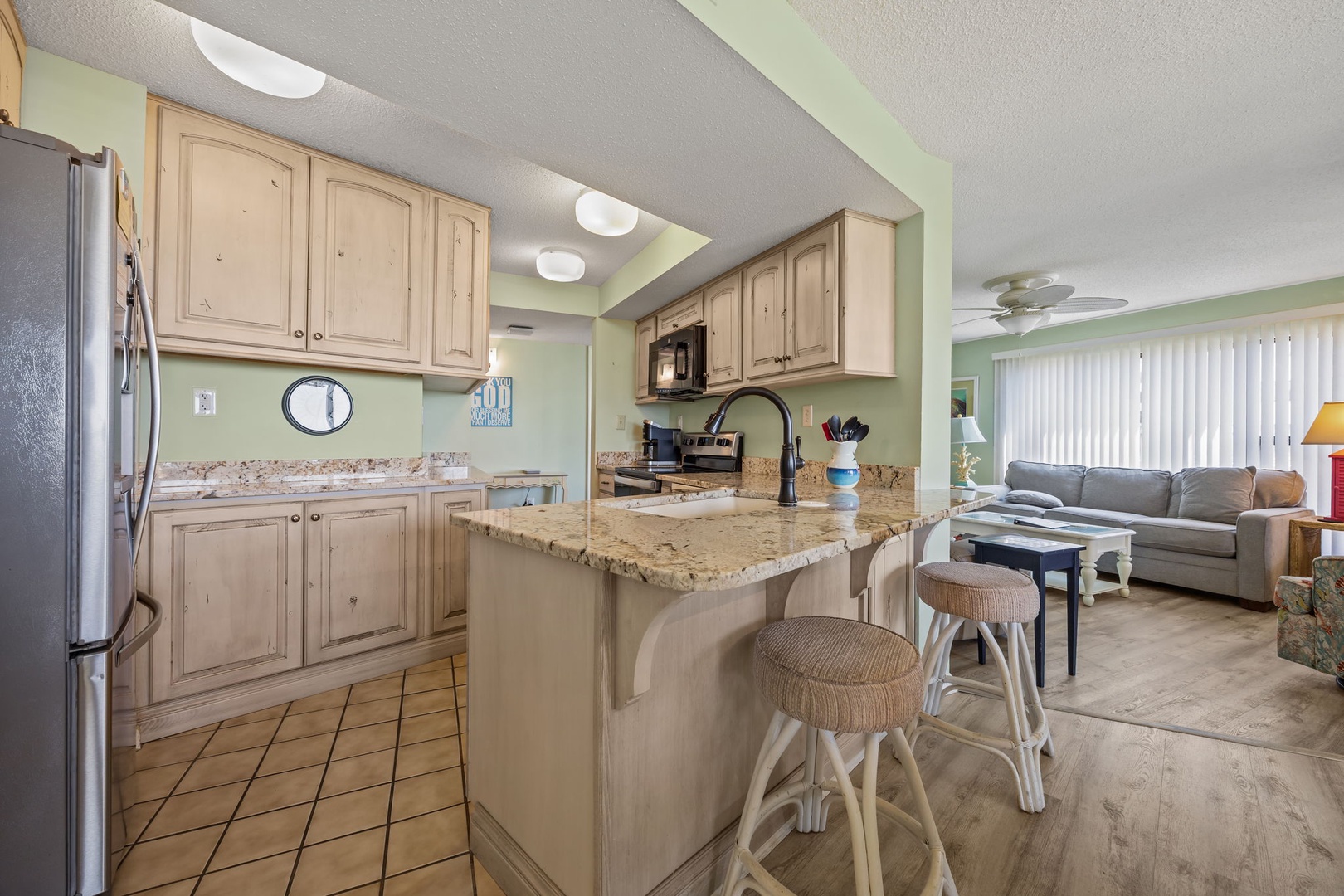 Your fully-equipped kitchen and cozy living space flow together perfectly, creating the ideal spot for preparing meals and unwinding after beach days.