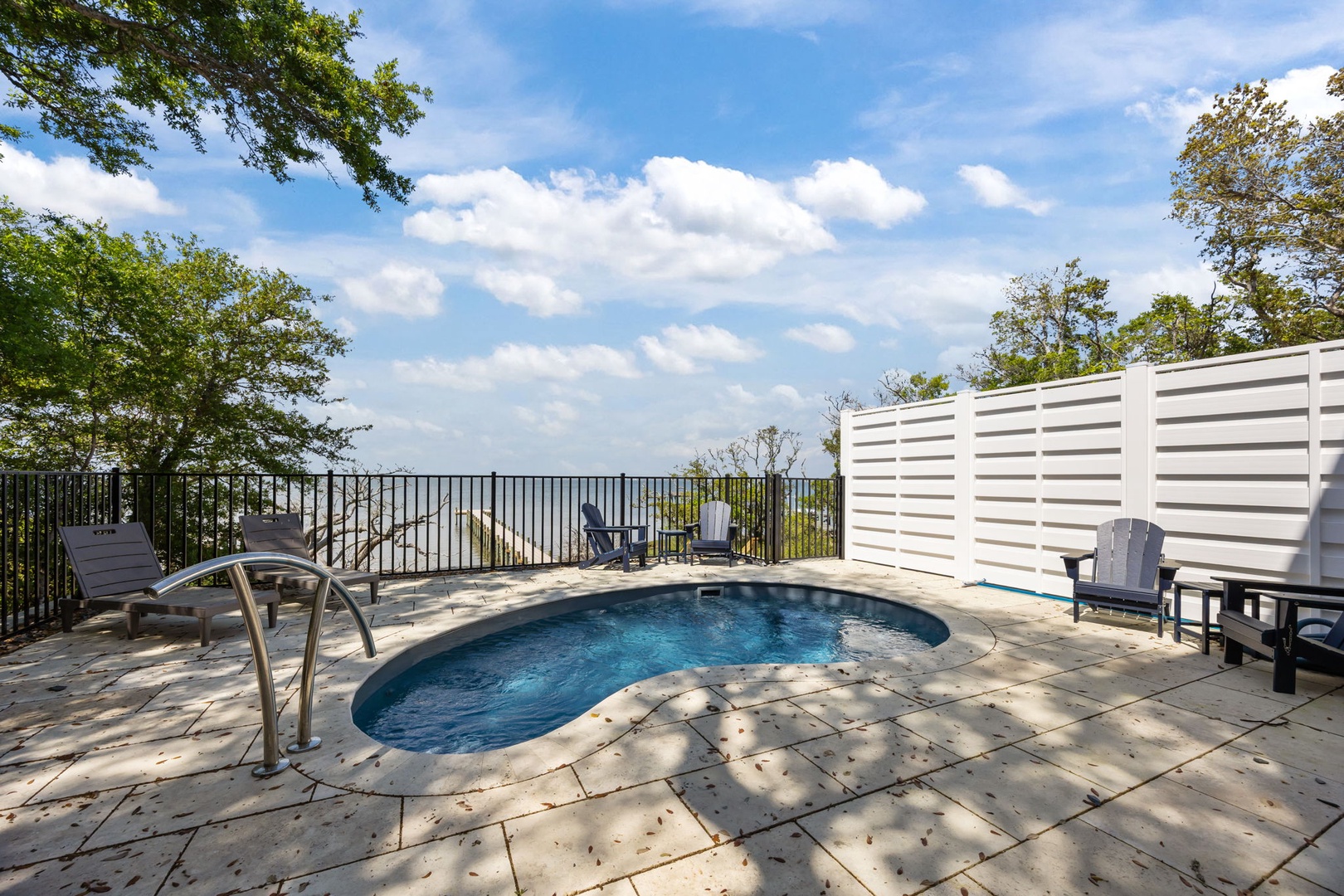 Soak in your private pool while enjoying stunning water views from this secluded deck retreat.