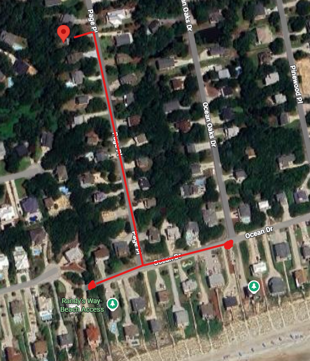 Aerial view of a residential neighborhood with tree-lined streets and Randy's Way Beach Access nearby for coastal adventures.