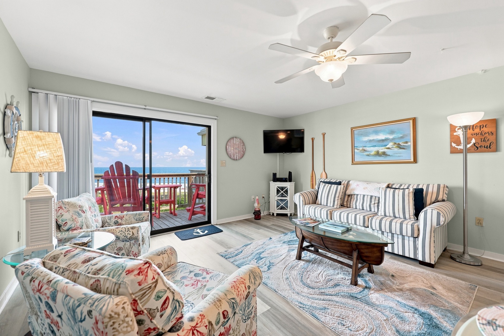 Char’s Cozy Condo | Living Area and Balcony Access