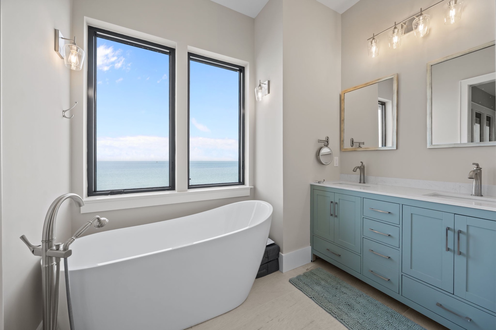 Soak in your private spa-like sanctuary with stunning ocean views. The elegant soaking tub and dual vanities create the perfect retreat.
